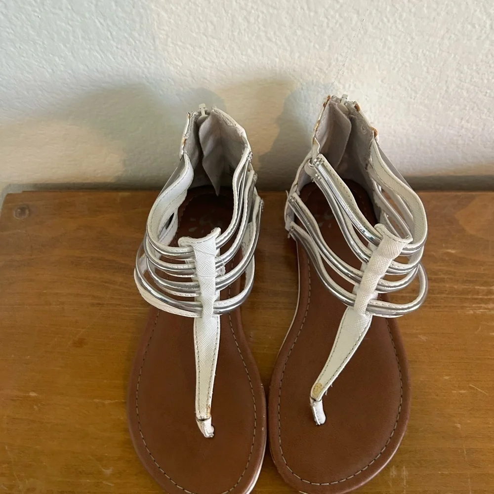 Youth size, one justice, gladiator, white, and silver sandals